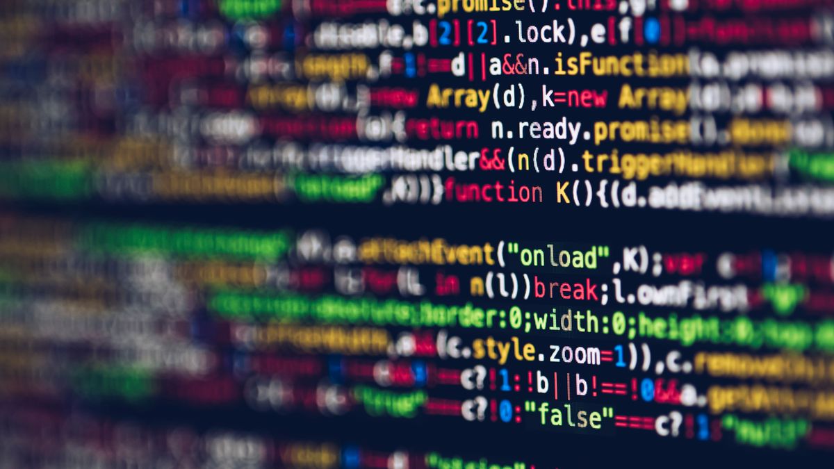 Computer screen filled with colourful lines of code on a dark background